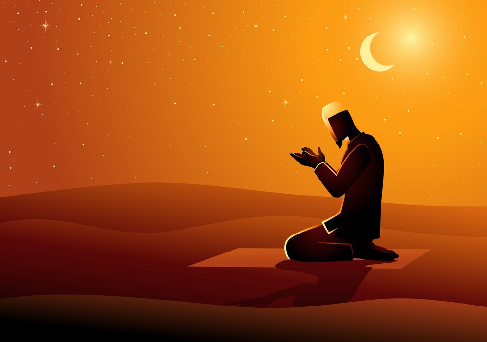 Muslim man praying in the desert